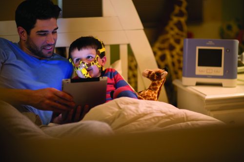 Wisp+Pediatric+with+Trilogy,+Child+and+Dad+with+Tablet+in+Bed+Hi+Res Wisp+Pediatric+with+Trilogy,+Child+and+Dad+with+Tablet+in+Bed+Hi+Res